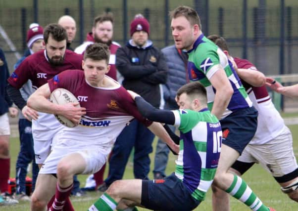 Gala YM try to create an opening against tough-tackling Dunbar, in green and blue (picture by Brian Gould).