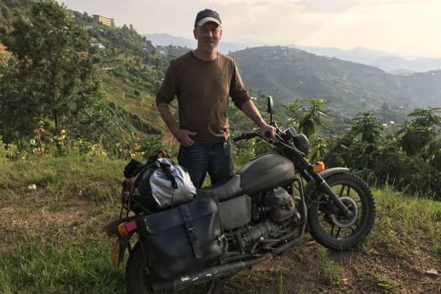Trusted bike...Rob Armstrong from Minto travelled from Uganda, into Rwanda and down to the Congo on a 1981 V50 Motorguzzi, still in its original Dutch army green livery.