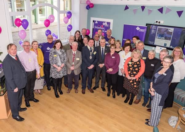 Provost Dean Weatherston from Kelso Community Council is pictured in the middle alongside Henry Simmons, chief executive of Alzheimer Scotland, alongside resource centre staff, local volunteers and supporters, as well as people living with dementia and their carers.