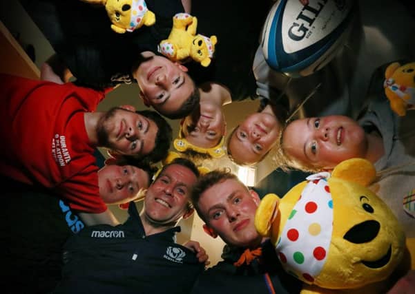 TD1 Youth Hub members during their visit last year from Children in Need's Pudsey Bear and former Scotland Rugby star Chris Paterson.