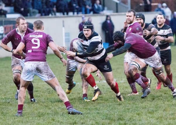 Committed attention to the action by both sides, each in their familiar colours - Gala in maroon and Kelso in black and white (picture by Gavin Horsburgh).
