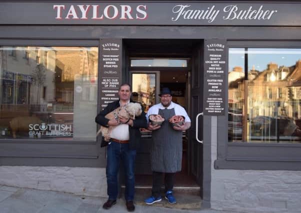 Calum Flanders, dog Lucy and John Taylor with the new sausages.