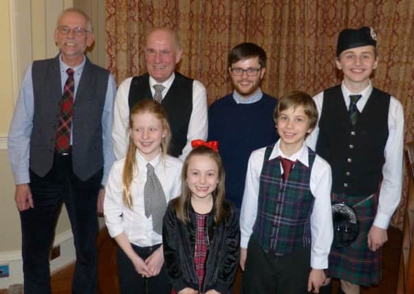 Bard Robert Burns was celebrated in style by Galashiels Rotary Club.
Member Alastair Christie organised a team of local young artists to showcase their talents.
Benji piped in the haggis which Poppy then addressed, pictured. More music was provided by Aidan and his dad, Eric, with songs from Mitchell and poems, courtesy of Nicole.
The youngsters audience of family and Rotarians was very appreciative.
Pictured, back row, from left  Eric, Alastair, Mitchell and Benji; front  Poppy, Nicole and Aidan.