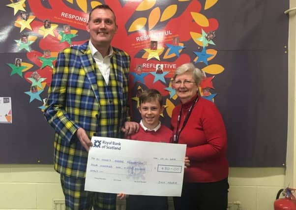 Doddie Weir, Jack Fourie and Dawn Fernie, deputy head teacher at Melrose Primary School.