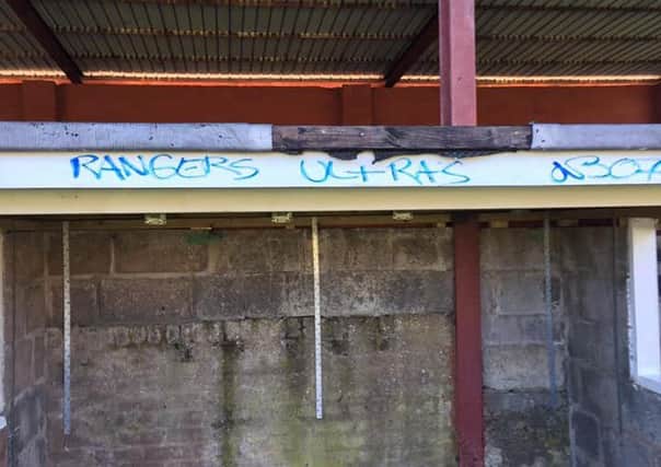 Vandals daubed graffiti on the stand and dugouts.