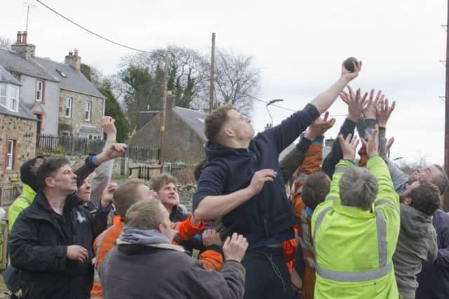 Robbie Elder powers through the pack to grasp the ba' at Ancrum.