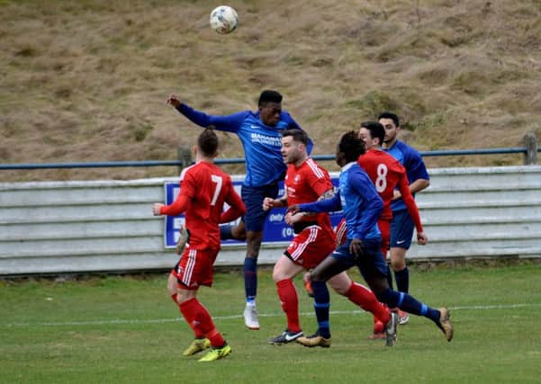 Royal Albert trialist Moses Njie heads the ball clear (Pic by Alwyn Johnston)