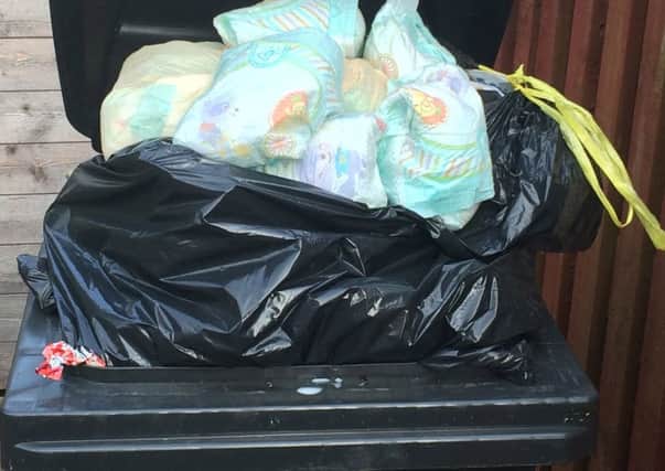 The council has refused to rule out three-weekly bin collections.