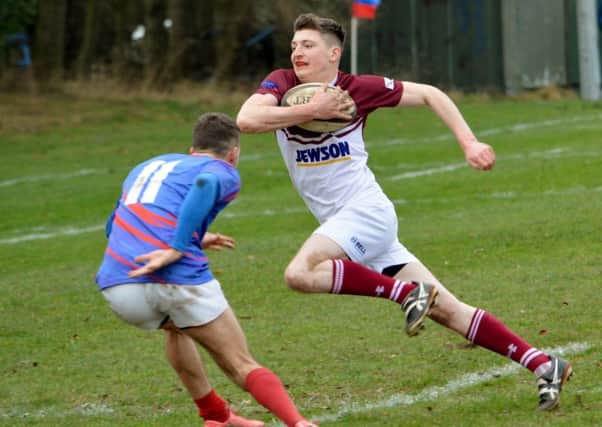 Gala YM try to craft an attacking move against blue-kitted Penicuik (picture by Brian Gould).