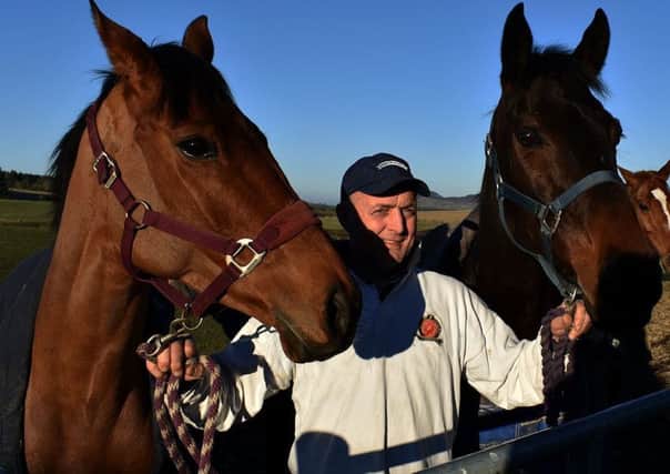 Stuart Coltherd pictured between the same weeks Coltherd Racing winners - Graystown (on left) and Budarri (picture by John Smail).
