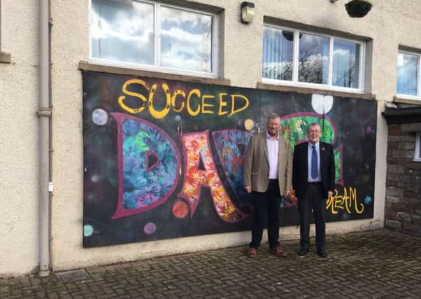 Councillors Neil Richards and, right, George Turnbull outside Hawick High School.