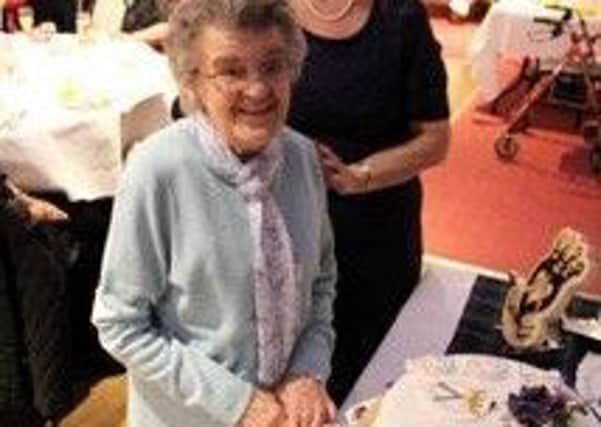 Lauder SWI centenary birthday cake was cut by Mary White