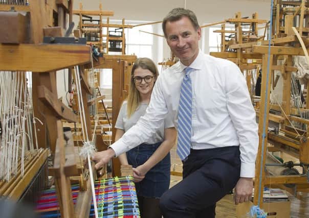 Screen printing technician Grace Smith with Jeremy Hunt and John Lamont and Professor Fiona Waldron head of school.