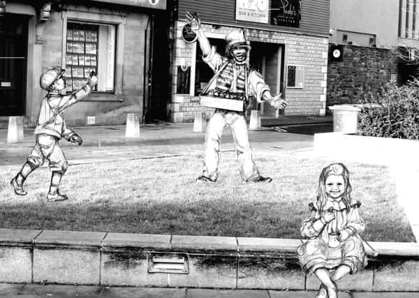 What Angela Hunter's statues of Robert Coltart and two young customers will look like.