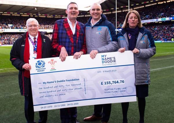 From left, Welsh Rugby Union president Dennis Gethin, Doddie Weir, former Scotland and Glasgow Warriors captain Al Kellock and Scottish Rugby Union president Dee Bradbury at Murrayfield at the weekend.