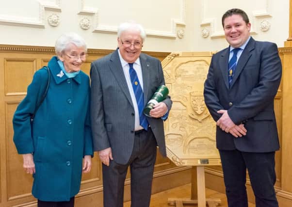 Kelso Community Council presented retiring member Alan Hall with a bottle of malt whisky at this months meeting in the town hall. Mr Hall is pictured with his wife and Kelso provost Dean Weatherston.