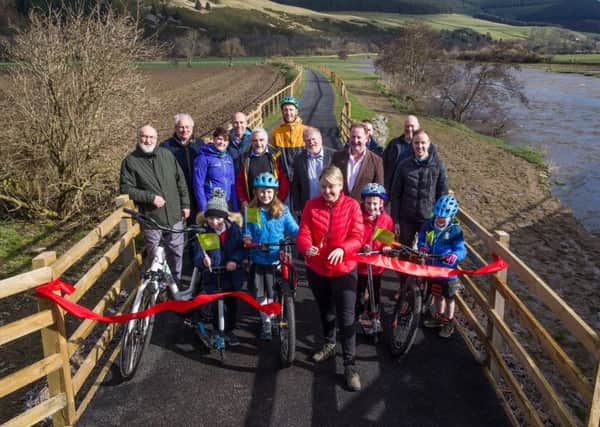 Council leader Shona Haslam, alongside several interested parties, officially opened the path between Innerleithen and Walkerburn.