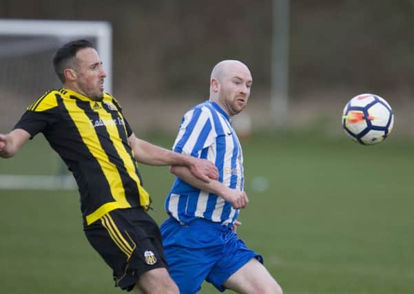 Stow, in black and yellow, were close to taking full points but Jed Legion dashed their hopes (picture by Bill McBurnie)