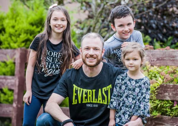 Phil Holden-Rushworth with his three children, from left: Freja, Bradley and Lainee.
