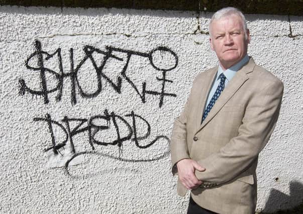 Councillor Davie Paterson is urging fellow Teries to help police track down the culprits responsible for graffiti spray-painted in Hawicks Old Manse Lane.