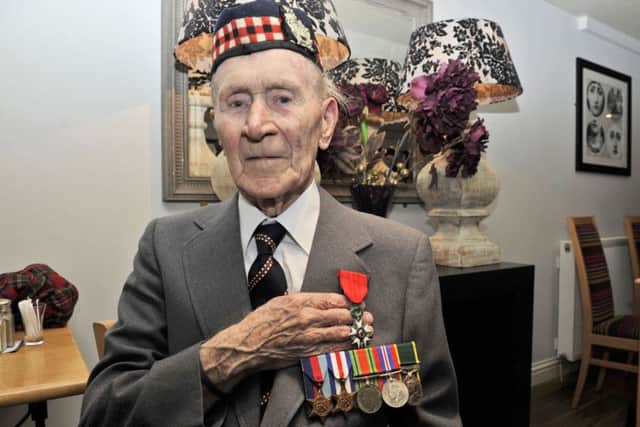 Jackie Webster proudly displays his French Legion of honour medal.