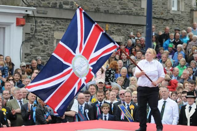 Kirsten Scott casting a flag at 2016's Selkirk Common Riding.