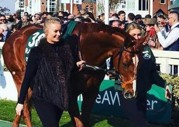 Connie Wishart (left) and Amy Coltherd lead Captain Redbeard around the Aintree parade ring (picture by Marion Pate).