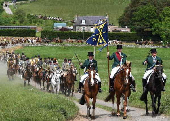 HAWICK, SCOTLAND - JUNE 08: Cornet Gareth Renwick and his equestrian supporters leaving St Leonard's during last year's Hawick Common Riding. Photo: Jeff J Mitchell/Getty Images