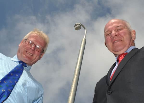 Councillors Stuart Marshall and Watson McAteer next to the surveillance camera watching over the town's Common Haugh car park.