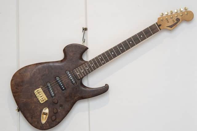 Not for sale...Robin freely admitted he had no idea how to make this guitar for his son. So he took one of his old instruments to pieces and worked it out! It's now on display in the museum but is far too precious to part with so it's not for sale, folks! (Pic: Phil Wilkinson)