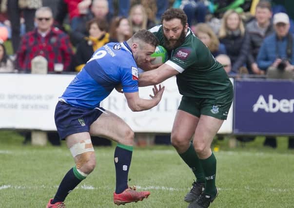 Bruce McNeil of Hawick wins this tussle for the ball against Boroughmuir at last weekend's Melrose 7s (picture by Bill McBurnie).