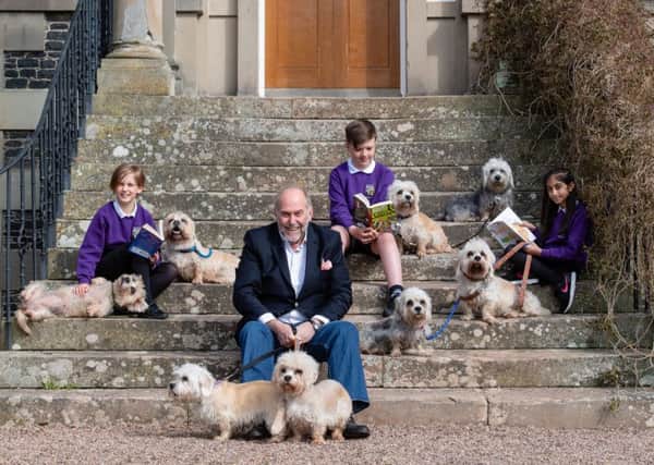 Borders Book Festival director Alistair Moffat and a trio of 11-year-olds from Melrose Primary School  Ellie Darlow, Ben Cook and Maryan Khan  launch this years programme with a bevy of beautiful Dandie Dinmonts.
