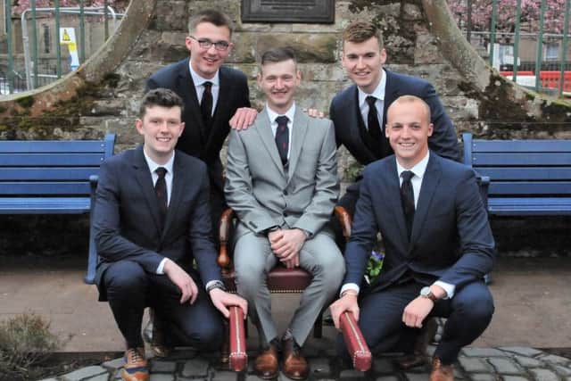 Royal Burgh Standard Bearer Craig Monks, flanked by his attendants (back row: Conall Fairbairn and Andrew McColm; front row:  Liam Cassidy  and Adam Nichol.