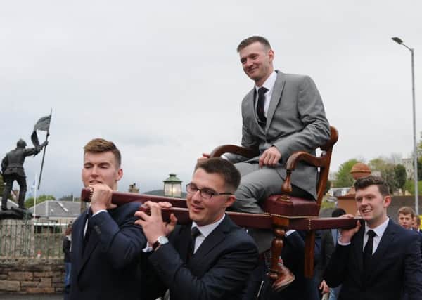 Craig Monks is carried on the traditional chair around the town before the Appointment Night Concert in the Victoria Halls.