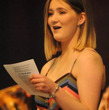 Talented young Souter Milly Coltherd led the singing in the hall.