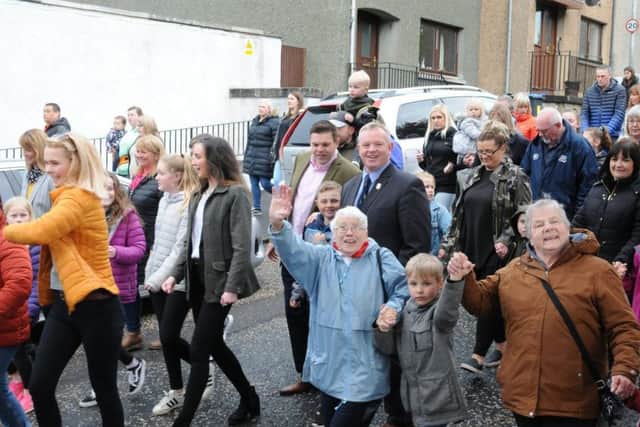 A large crowd joined the procession around the town.