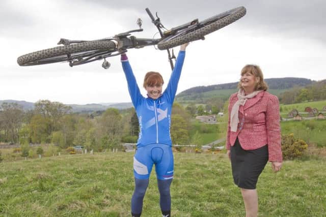 Isla Short from Peebles with tourism secretary Fiona Hyslop at the Mountain Bike Centre of Scotland.