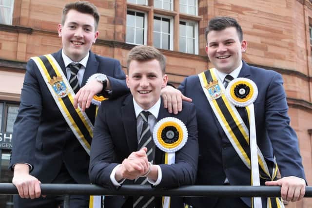 Melrosian for 2019, Ben Magowan, flanked by his right and left hand men, Harry Fletcher and Russell Mackay, who carried him three times round the Mercat Cross, as tradition dictates.