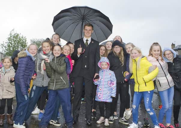 Hawick Cornet Connor Brunton with youngsters ready for the walk around the town.