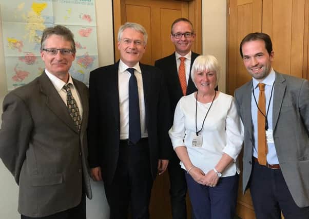 Transport minister Andrew Jones, second from left, and Borders MP John Lamont, third from left, with Campaign for Borders Rail officials, from left, Simon Walton, Marion Short and Nick Bethune.