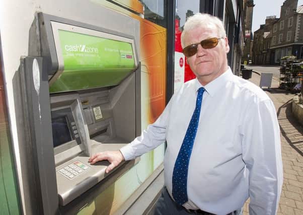 Councillor Davie Paterson at the cashpoint outside Hawick's Sandbed Post Office.