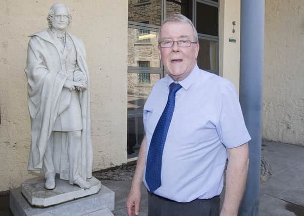 Councillor George Turnbull at the James Wilson statue at Tower Mill, Hawick.