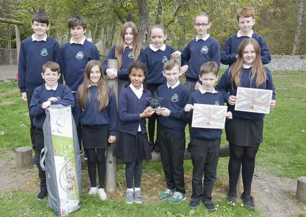 Heriot Primary School pupils with their award and gazebo.