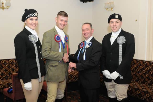 Craig Monks receives his spurs from Gala Souters chairman George Emond.