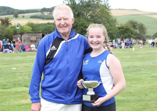 TLJT member Molly Noble, with coach Jock Steed, pictured at last year's Morebattle Games (library image).