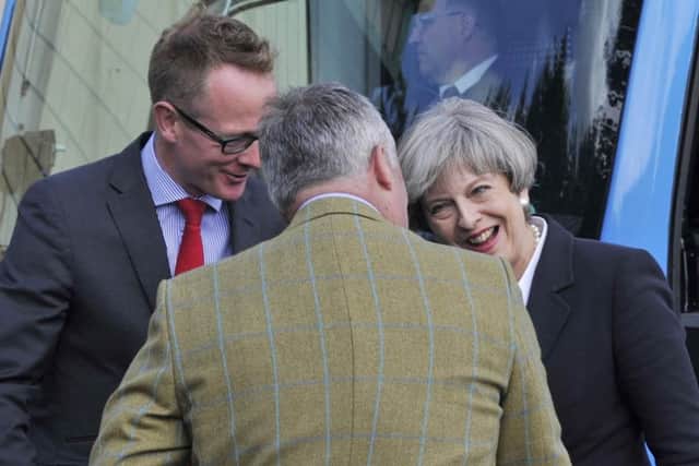 Happier times: Prime minister Theresa May visits Abbey Tool and Gauge in Kelso in 2017, with prospective candidate John Lamont and Abbey's production manager Alistair Reid.