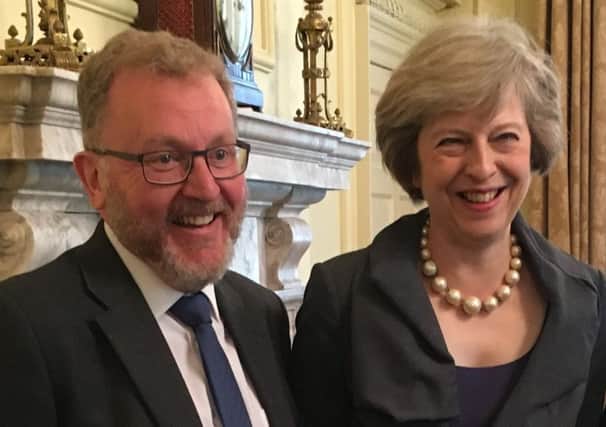 Happier times: David Mundell with Theresa May.