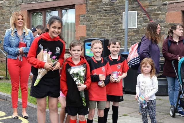 Tweedbank Thistle players ready for the parade with flowers and food