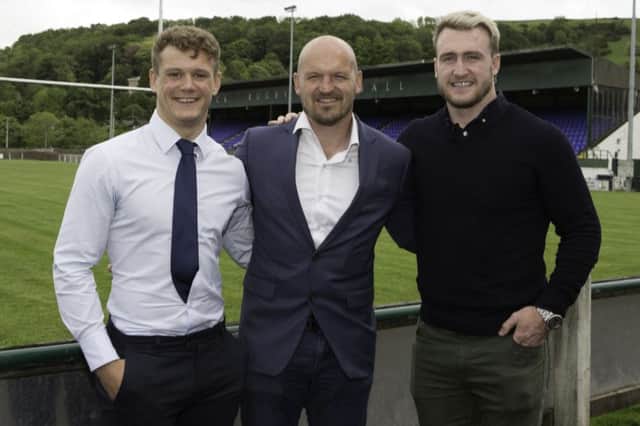 Darcy Graham, left, Gregor Townsend and Stuart Hogg in the shadow of the HAwick RFC stand.