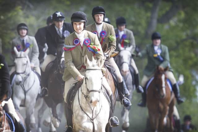 Action and revellers on Common Riding Friday in Hawick.